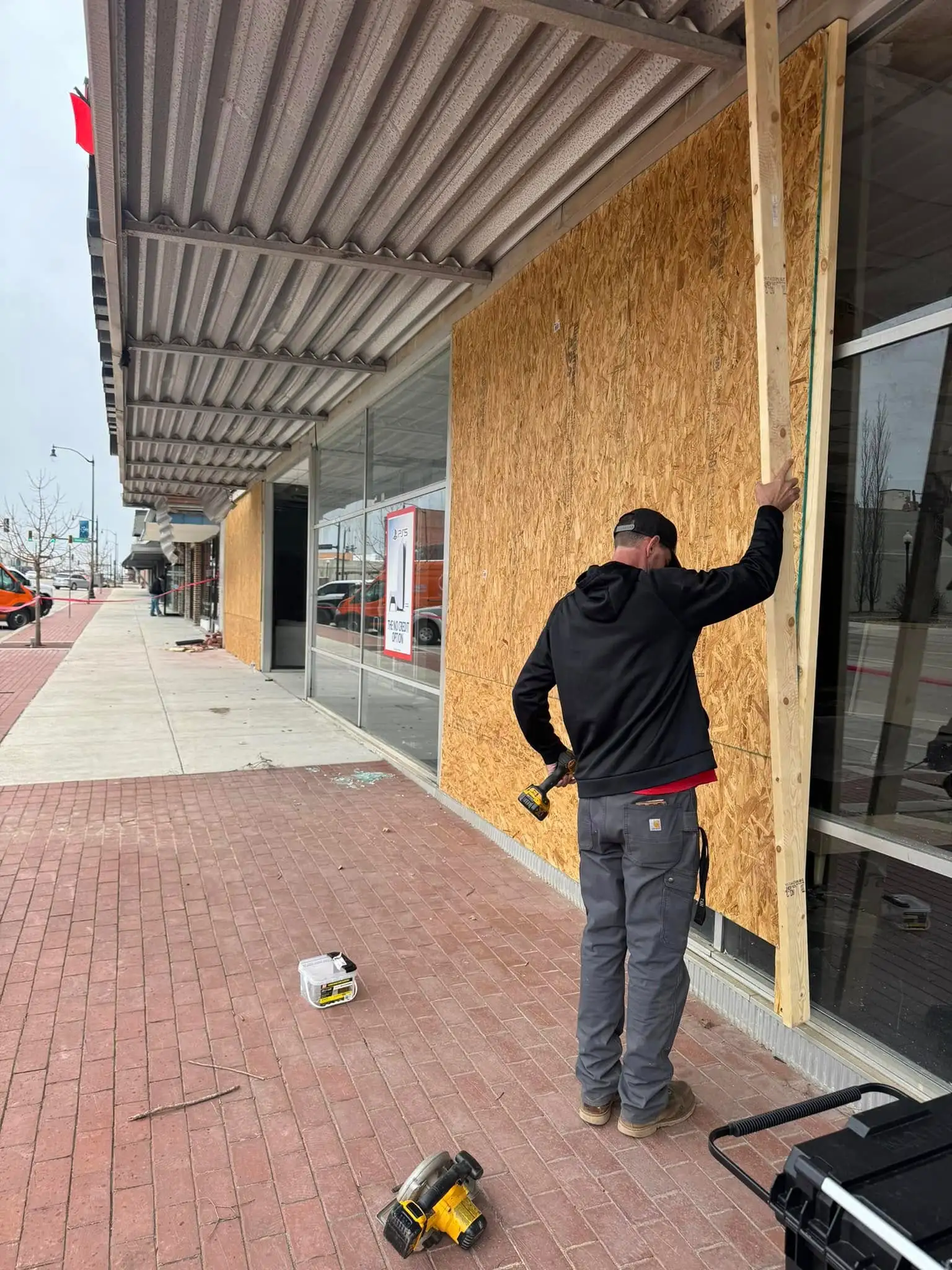 Professional window installer working on a residential window replacement project
