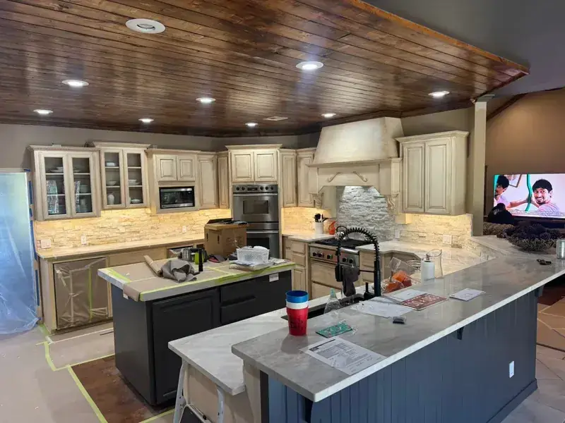 Kitchen with island, countertops and wood ceiling, C&A Roofing & Construction
