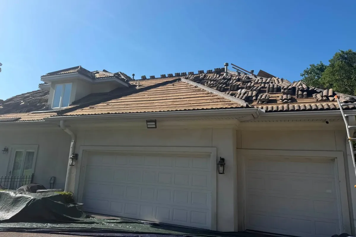 Tile roof removal on stucco house above garage, C&A Roofing & Construction