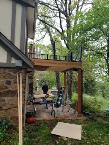 Elevated deck construction with metal railings