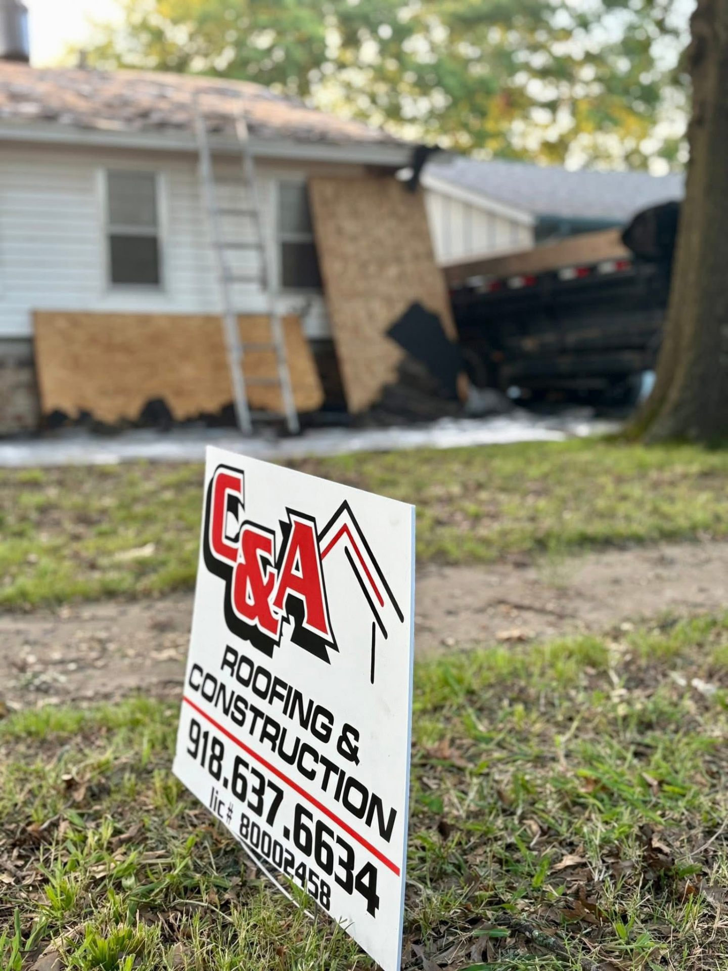 C&A Roofing & Construction professional job site with company signage in Oklahoma
